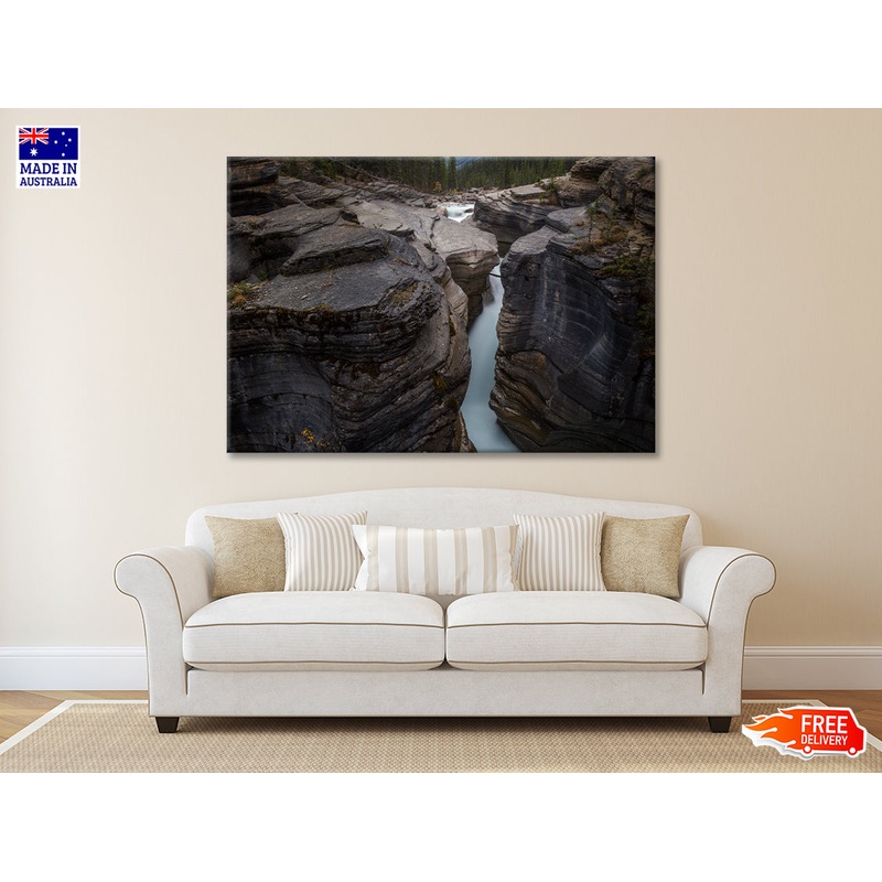 A River Flows through Cascading Over a Rocky Cliff Print 100% Australian Made