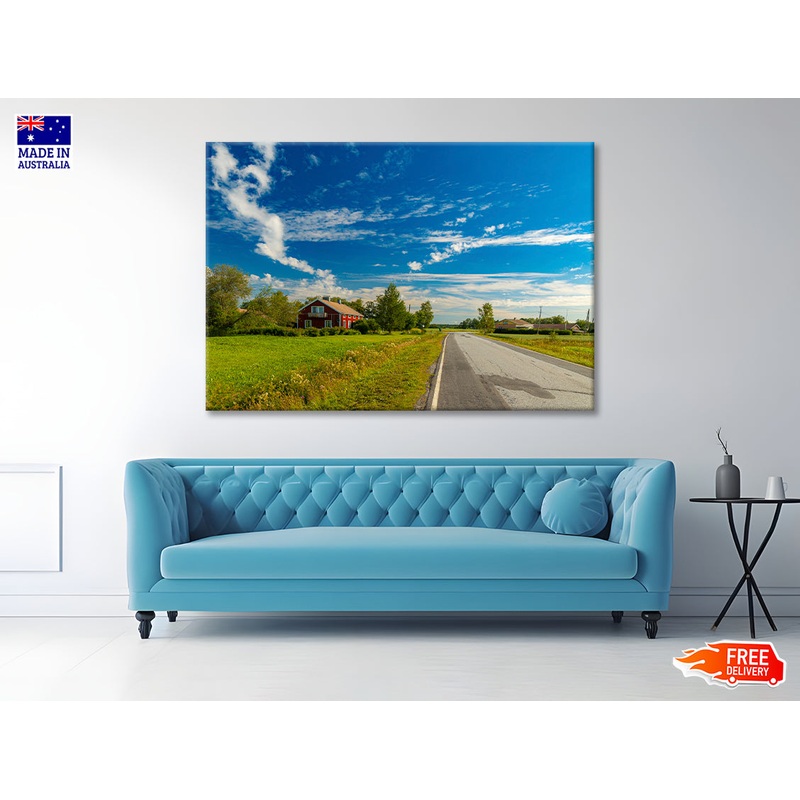 A Rural Road with Grass and Trees under a Cloudy Sky Print 100% Australian Made